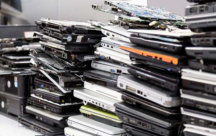 A stack of discarded laptops.